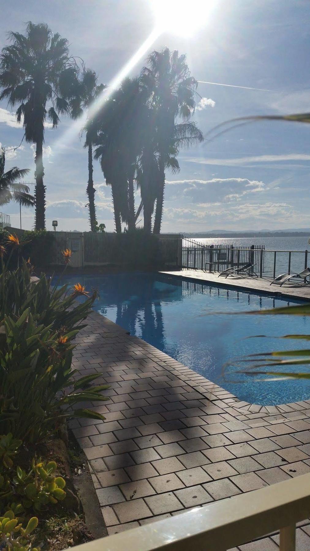The Beachcomber Hotel & Resort, Ascend Hotel Collection Toukley Eksteriør bilde View of the pool at the hotel
